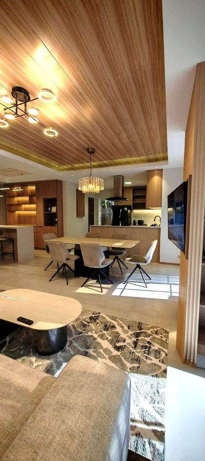 Casa Soriano — living and dining with timber ceiling