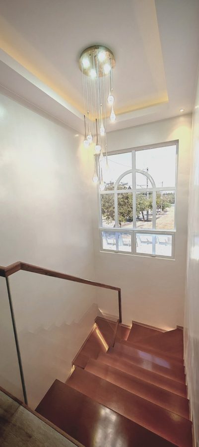 Casa Soriano — stair landing and feature pendant