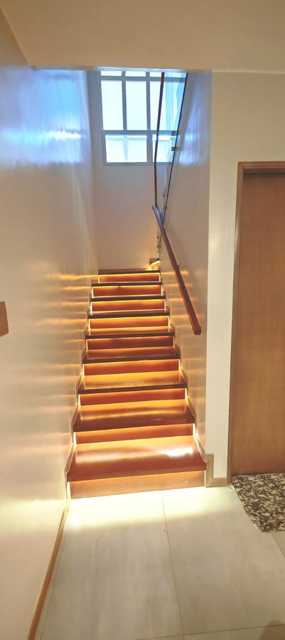 Casa Soriano — backlit timber stair