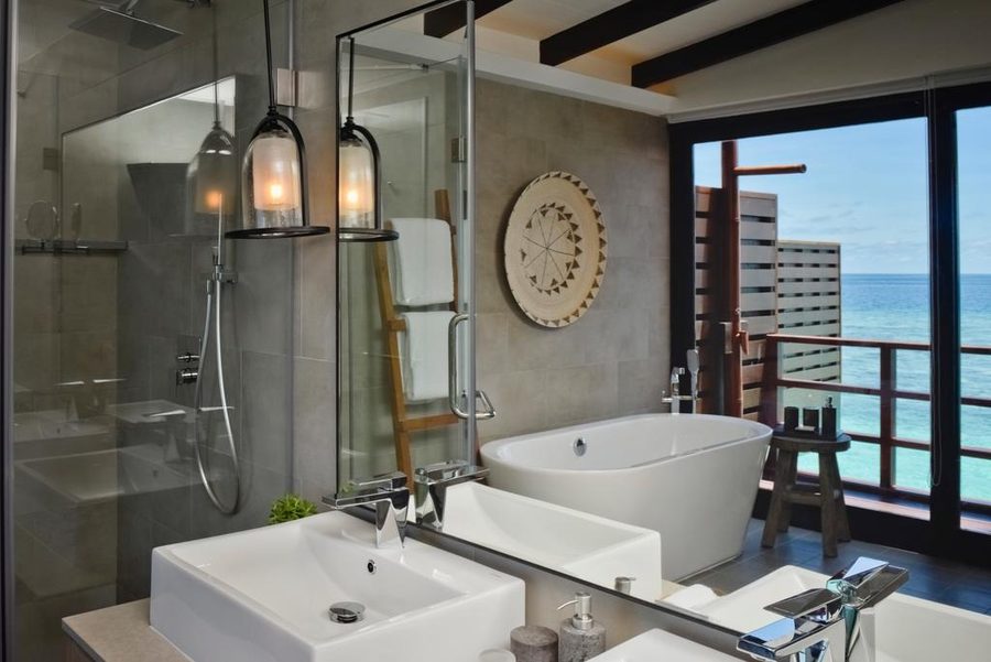 Grand Park Maldives — overwater bathroom with lantern pendants